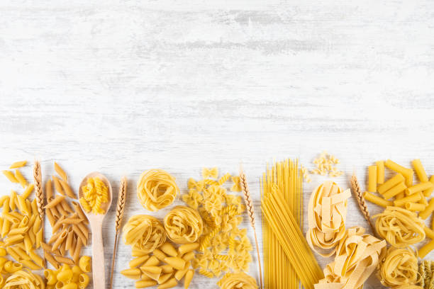 istock Different Types of Italian Pasta on Rustic Wooden Table 1330017539