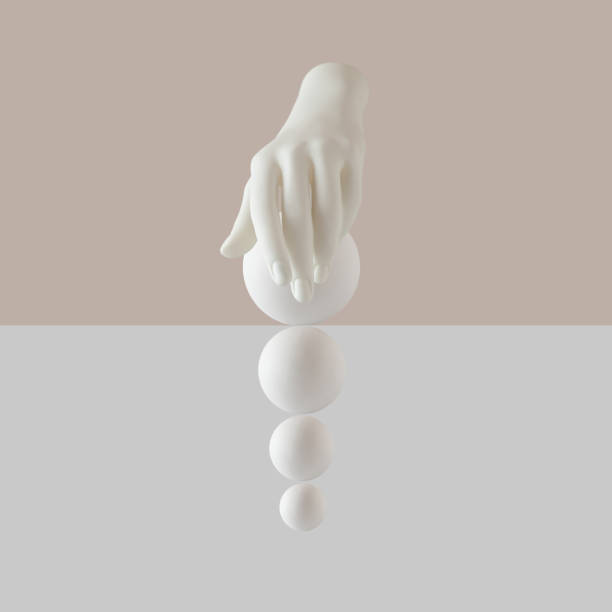 istock Creative arrangement with artificial hand and white balls over pastel beige and white background 1330019097