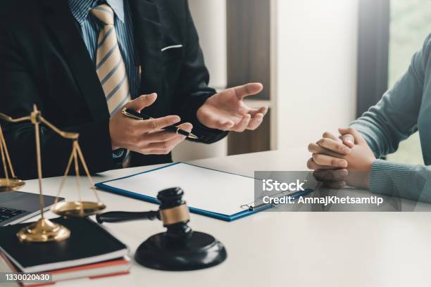 Image Lawyer Businessman Sitting At The Office With A Woman Customer Explaining The Agreement Of Advice Stock Photo - Download Image Now