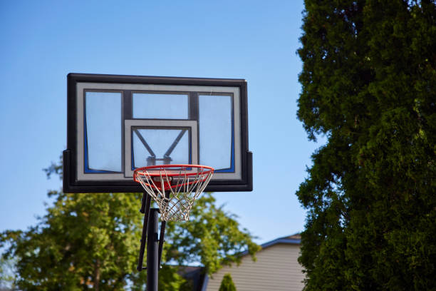 istock Basketball backboard with a ring on an indoor yard. 1330022683