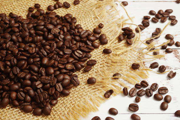 istock Roasted Coffee Beans on wooden background 1330022802