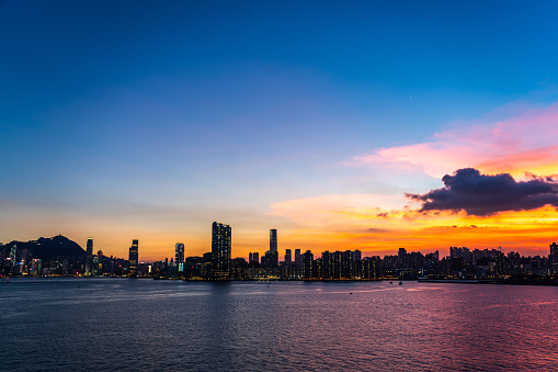 Cityscape and skyline at victoria harbour in hong kong city at sunset time