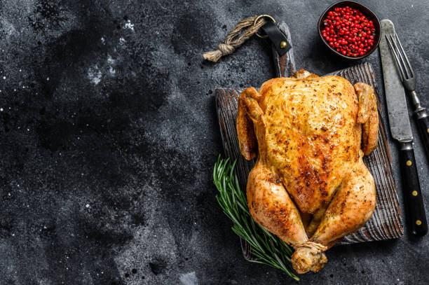 istock Grilled roasted whole Chicken.  Black background. Top view. Copy space 1330026207