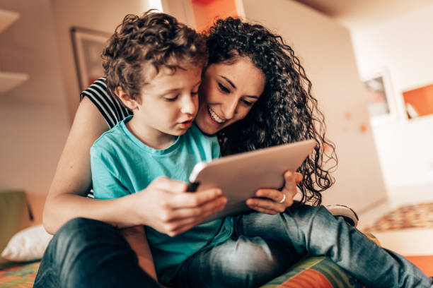 istock sister helping the little brother with homework 1330030537