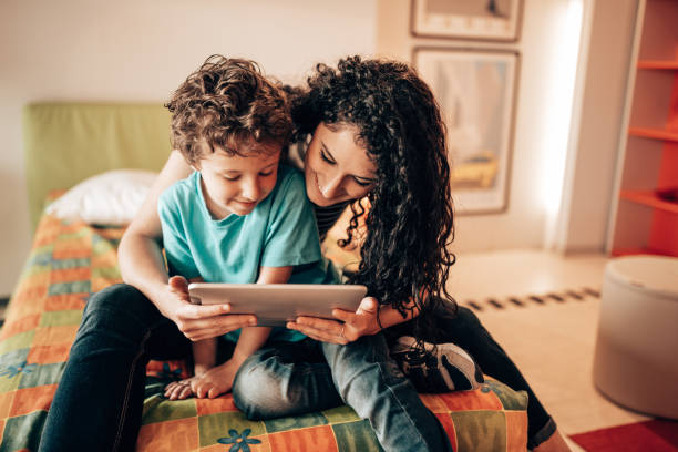 istock sister helping the little brother with homework 1330030758