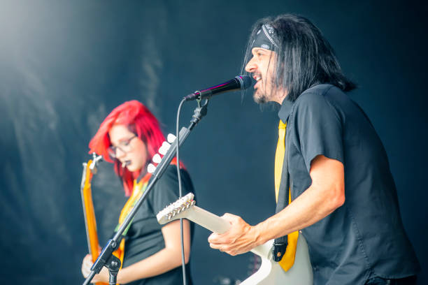 A pop punk band performing live on stage.\n\n*inspector - headstock altered **