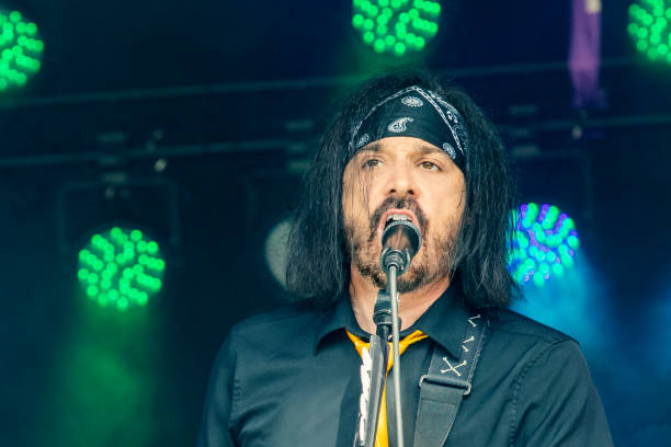istock Male Rock Singer Performing Live on Stage 1330031918