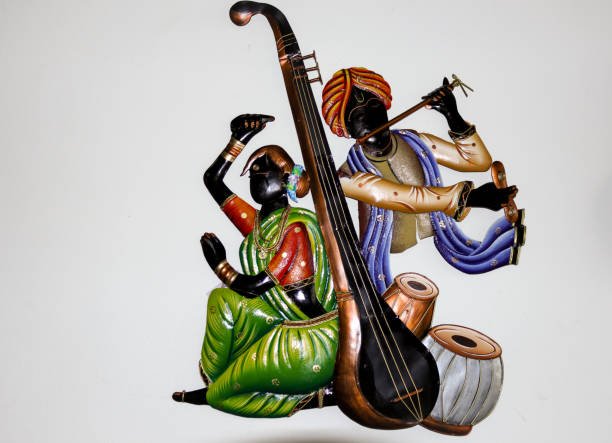 A Handcrafted metal artifact made by Rajasthani women at a cottage industry depicting Hindu deities Krishna and Radha for Home decoration in India. A Handcrafted metal artifact made by Rajasthani women at a cottage industry depicting Hindu deities Krishna and Radha for Home decoration in India. pictures of krishna stock pictures, royalty-free photos & images
