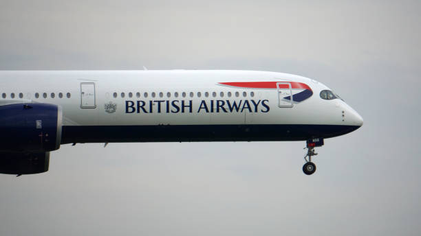 British Airways Airbus A350 Prepares for Landing at Chicago O'Hare Chicago, IL, USA. British Airways Airbus A350 prepares for landing at Chicago O'Hare International Airport on a busy summer travel evening. british airways stock pictures, royalty-free photos & images