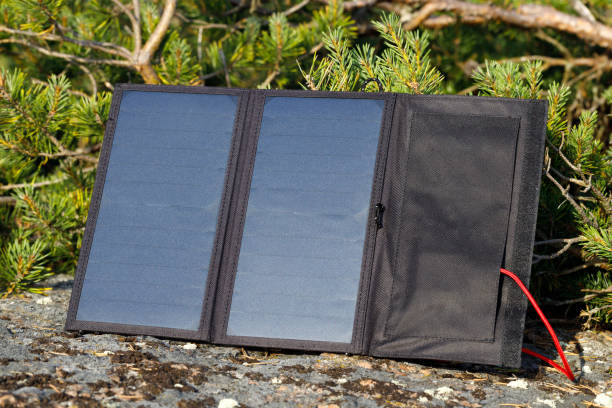 istock Outdoor travel solar panel charging. 1330036127