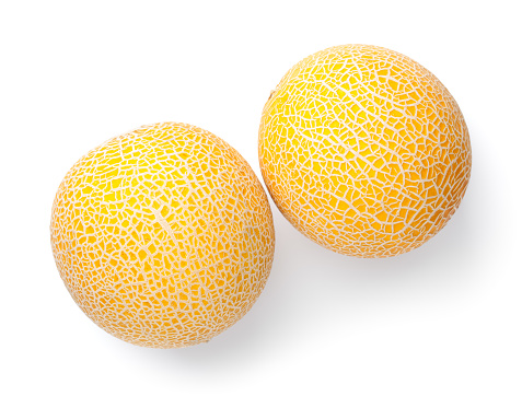 Galia melon isolated over white background. Two fresh whole fruits. View from above