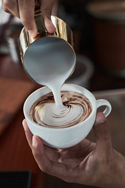 istock coffee latte art making by barista 1330043303