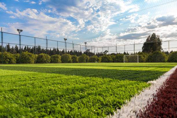 istock Cloudy beautiful sky football / soccer field 1330045064