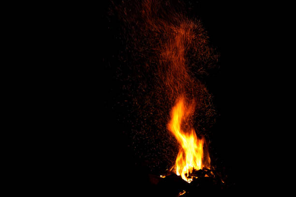 Photo of bonfire flame sparks tracks fire