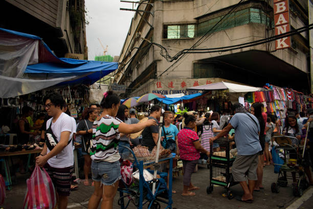 Divisoria crowd Manila, Philippines - July 21, 2019: Crowd along the streets of Divisoria, Manila. divisoria market stock pictures, royalty-free photos & images