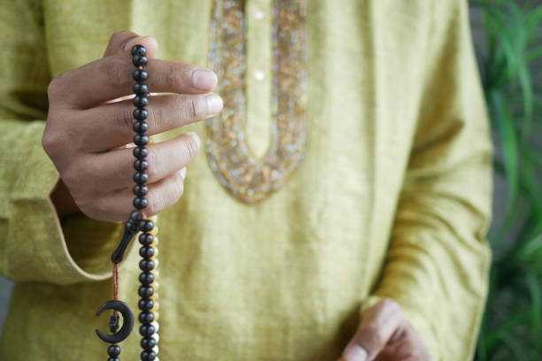 istock muslim man keep hand in praying gestures during ramadan, Close up 1330053441
