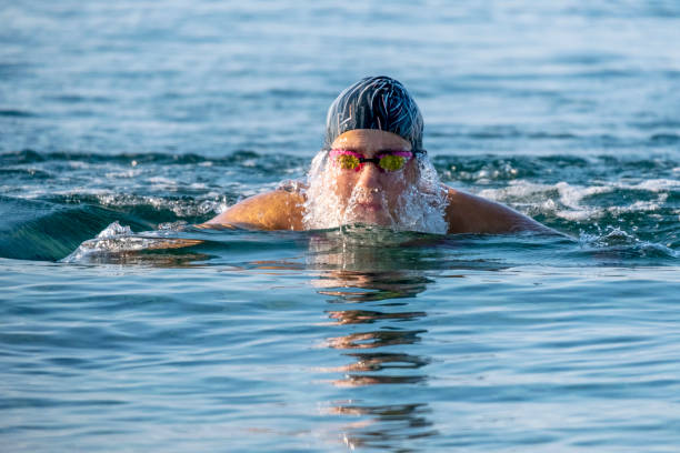 istock Close-up on professional swimmer face getting off the water 1330054671
