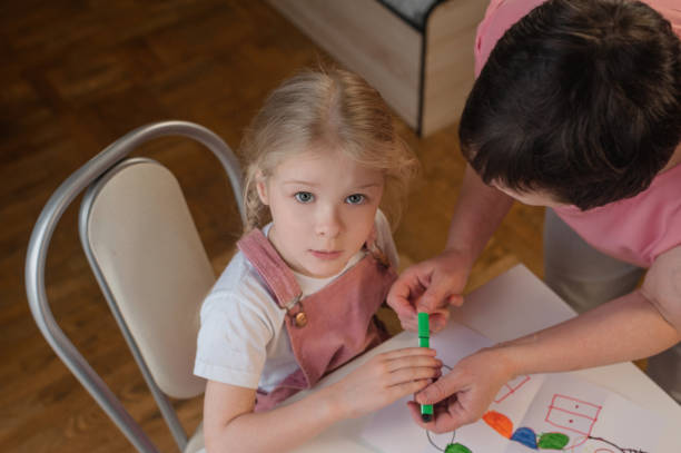 istock grandmother draws with granddaughters home 1330054814