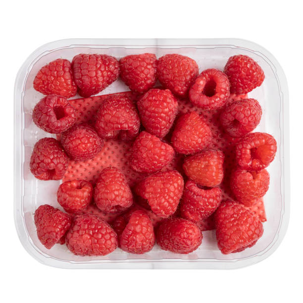 istock red raspberries  in plastic box container isolated on white background,top view 1330054829