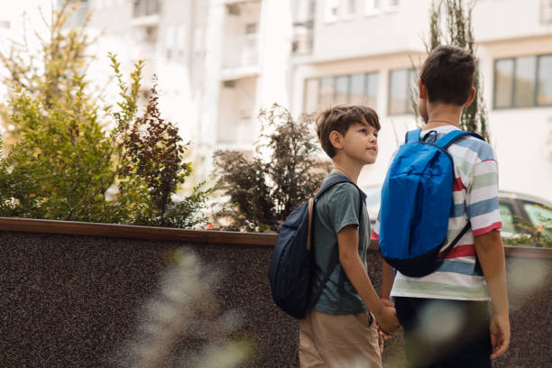 istock Two schoolboys are going to school. 1330055125