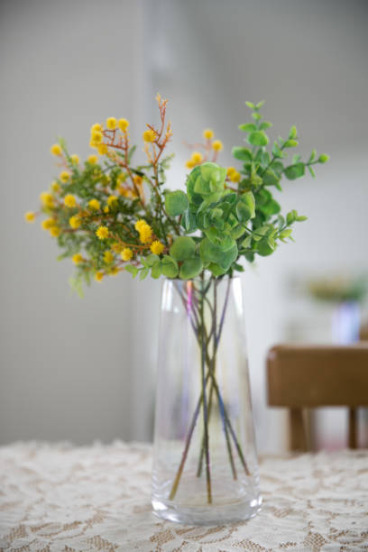 istock Vase with yellow flowers on white background. 1330055137