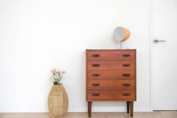 chest of drawers interior decor with white wall.