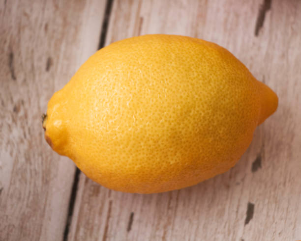 istock Lemon with rough yellow peel.plenty water drops around 1330056464