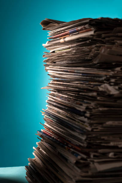 istock Pile of newspapers, studio shot. 1330057274