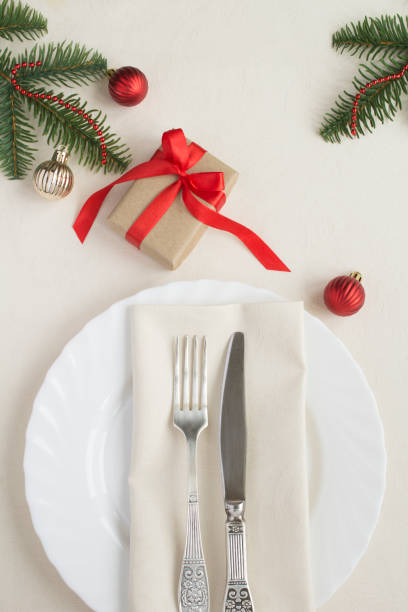 istock Christmas table setting on the beige tablecloth. Top view. Close-up. 1330057302