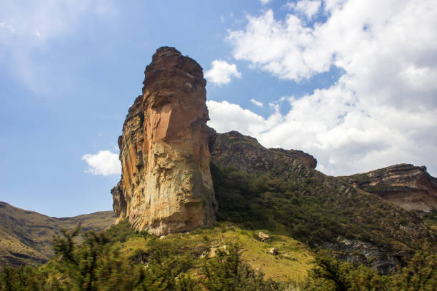 The sandstone Butress, the Brandwag standing watch over the entrance to the Goden Gate Highlands National Park Looking up at the Brandwag, the iconic Sandstone Buttress in the Golden Gate Highlands National Park, in the Free State Drakensberg Mountains of South Africa golden gate highlands national park stock pictures, royalty-free photos & images