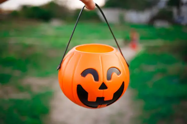 Photo of a basket for halloween sweets in the form of a pumpkin