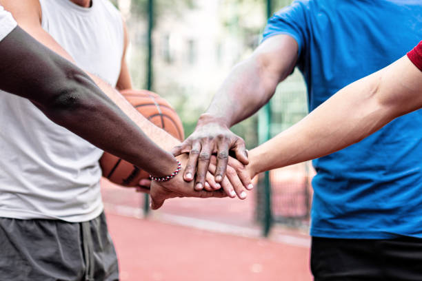 istock sportsteam putting hands together 1330058927