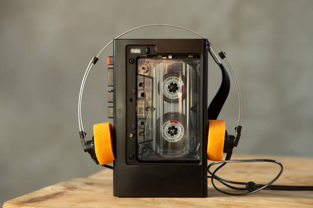 Music listening concept. Vintage cassette tape, audio player and headphones. stock photo