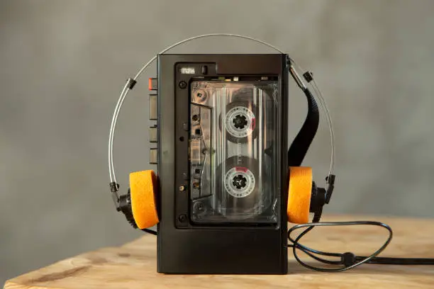 Music listening concept. Vintage cassette tape, audio player and headphones.