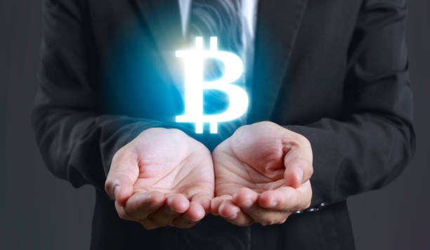 istock Hands showing bitcoin as virtual money on digital 1330059701
