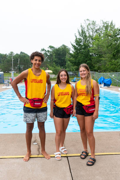 istock Happy teen lifeguards 1330059952