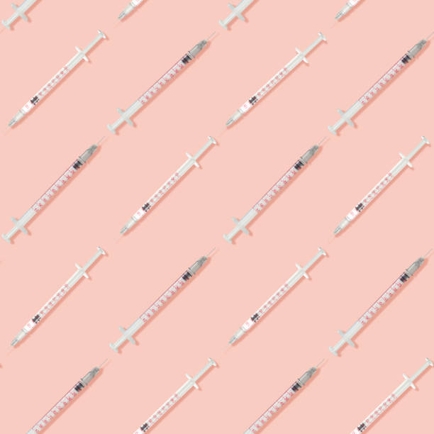 istock Contemporary art collage. Small long injection syringes with needles arranged in even rows over pastel pink background. 1330061040