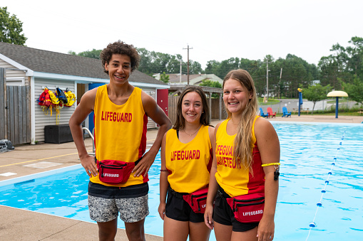 Happy teen lifeguards