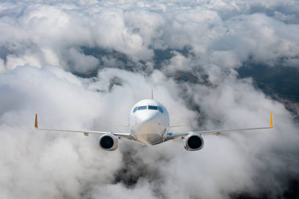 istock Commercial Jet airplane flying over clouds. 1330062156