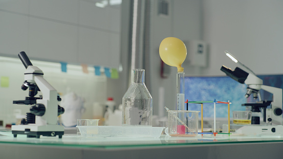 Laboratory with colorful liquids and ballon waiting for students
