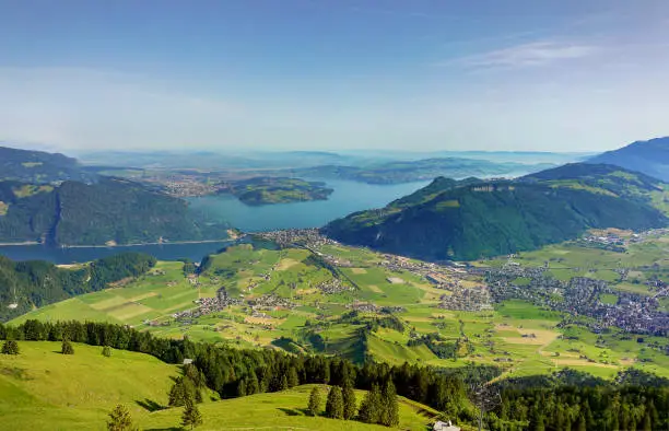 Magnificent panoramic aerial views of central Switzerland, mountains, villages and Lake Lucerne as you ascend the Cabrio cable car up Mount Stanserhorn in Switzerland. City of Stans.