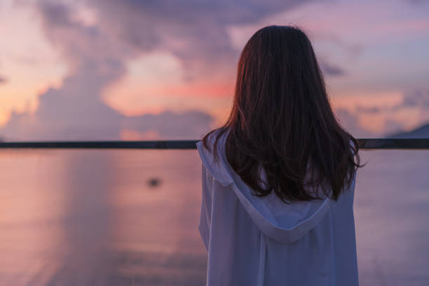 woman looking at sunrise