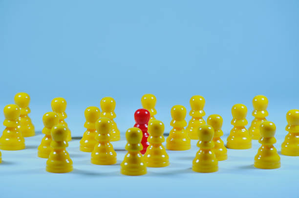 istock Concept with colored pawns. Individuality, standing out in the group. 1330073272