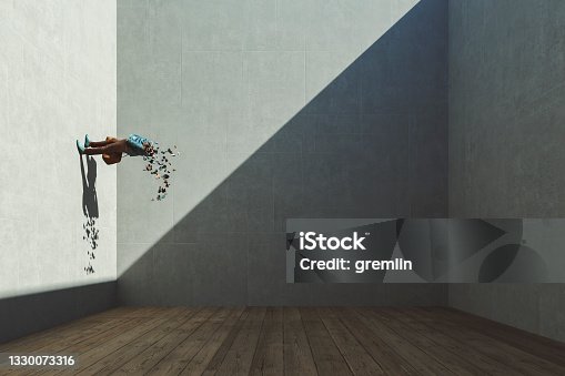 istock Abstract exploding businessman standing on the wall 1330073316