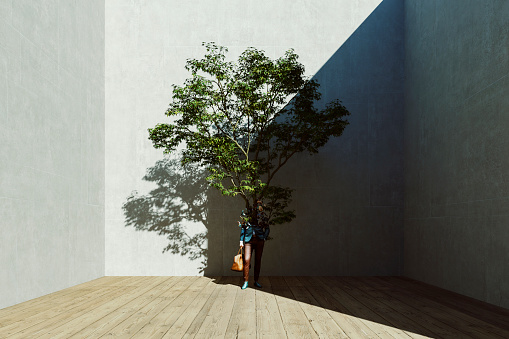 Growing tree out of businessman, 3D generated image.