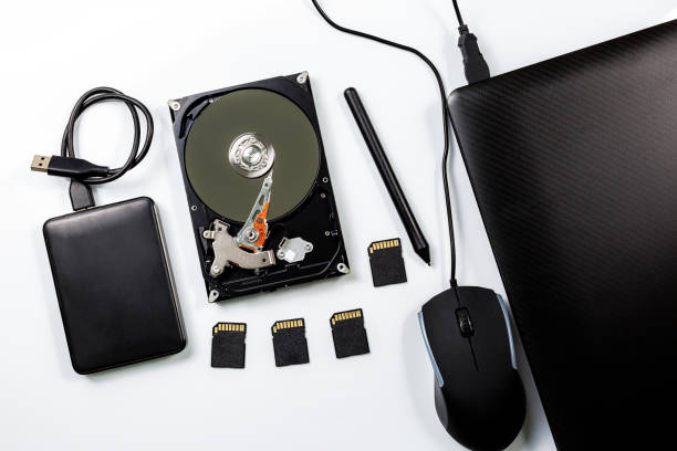 computer and hard disk device on white background - open harddisk flash imagens e fotografias de stock