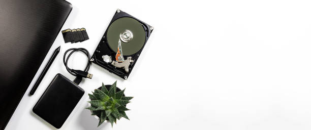 computer and hard disk device on white background - open harddisk flash imagens e fotografias de stock