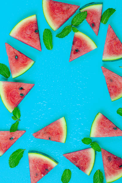 istock watermelon on a blue background,web banner and minimal flat lay creative design for group of summer fruits with fresh watermelon and pine apple on pastel color background 1330079058