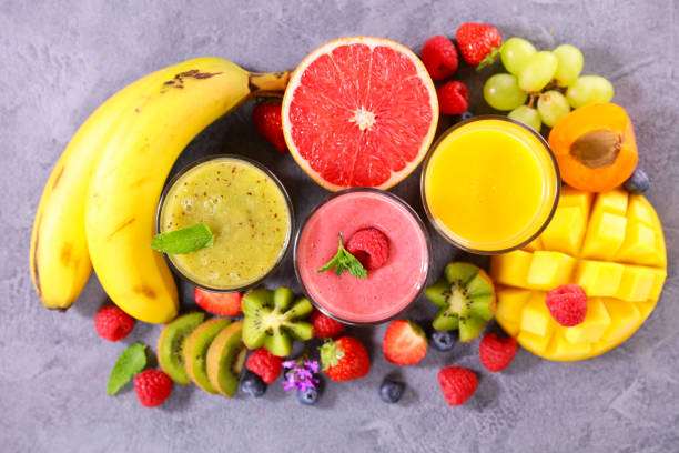 istock assorted of fresh fruit smoothie- top view 1330080742