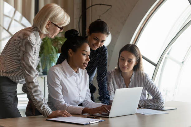 istock Confident young Asian professional presenting project to coworkers 1330082255